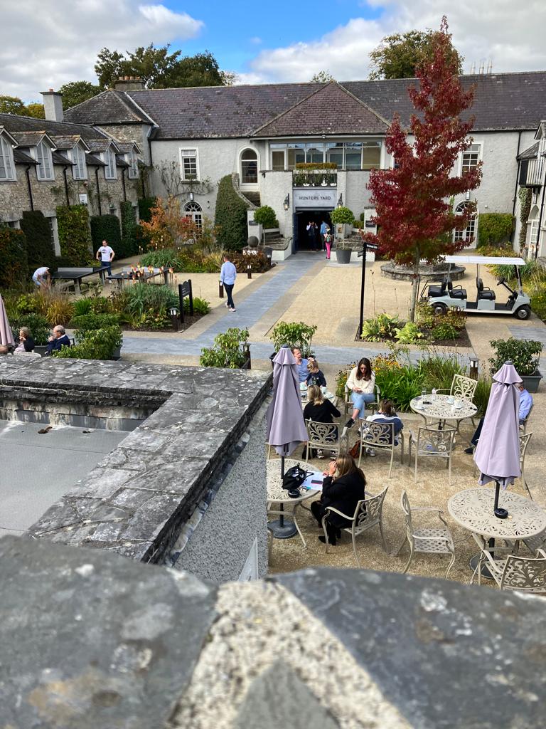 Attendees of the Ireland Golf Tour Operator Association (IGTOA Annual Conference on a courtyard, pictured from above)